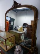 A VICTORIAN GILT SHAPED OVAL MANTEL MIRROR. H 130 x W 154 cm's