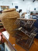 AN ALIBABA STYLE BASKET TOGETHER WITH A VINTAGE WOODEN BIRD CAGE.