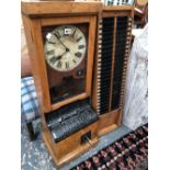 A VINTAGE OAK CASED TIME CLOCK AND ACCOMPANYING CARD HOLDER BUCK TIME RECORDER LIMITED 188 GRAYS INN