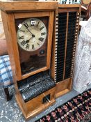 A VINTAGE OAK CASED TIME CLOCK AND ACCOMPANYING CARD HOLDER BUCK TIME RECORDER LIMITED 188 GRAYS INN