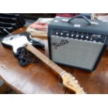 A FENDER FRONTMAN 15R AMPLIFIER TOGETHER WITH A FENDER SQUIER STRAT GUITAR