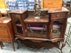 A LATE VICTORIAN MAHOGANY SIDE CABINET, THE CENTRAL GLAZED DOOR RECESSED BELOW CURVED BLIND FRET