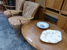 A PAIR OF ERCOL ARMCHAIRS TOGETHER WITH AN OVAL COFFEE TABLE. W 99 x D 83 x H 44cms.