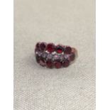 A ANTIQUE GEORGIAN STYLE GARNET AND DIAMOND HALF HOOP RING WEIGHT 3.3grm