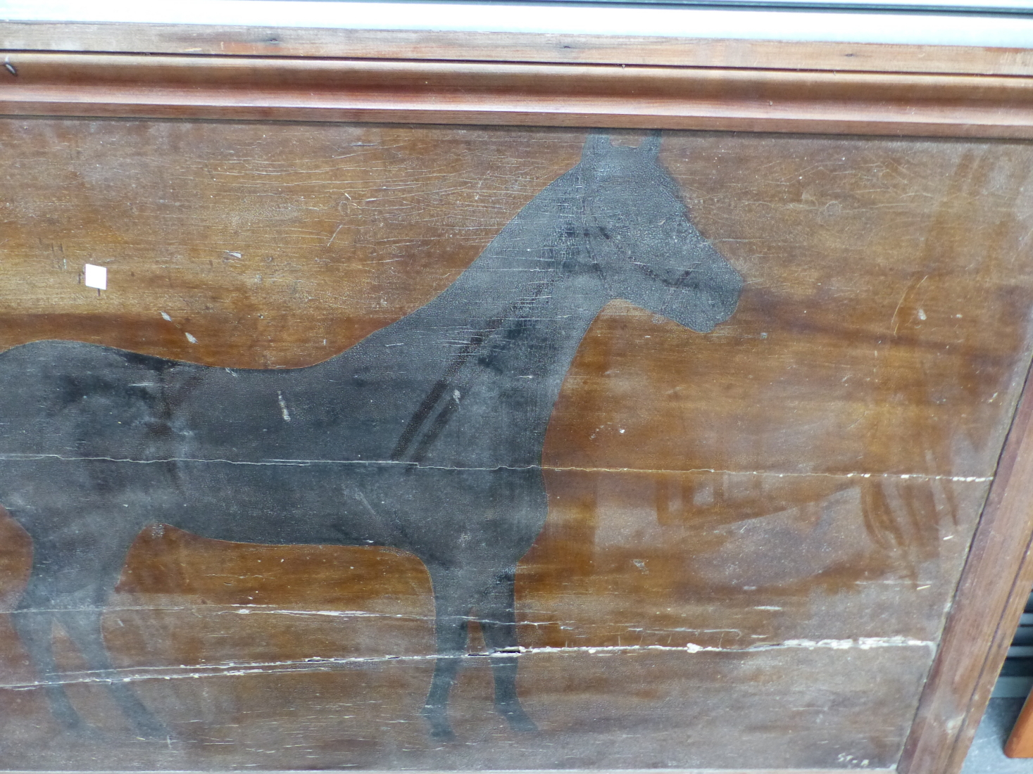 A LARGE PAINTED WOODEN PANEL DEPICTING A BLACK HORSE POSSIBLY FROM PUBLIC HOUSE