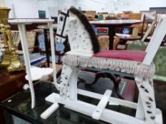 A RUSTIC PAINTED CHILD'S ROCKING HORSE AND A SMALL CLOVER LEAF SHAPED TABLE (2)