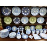 A COLLECTION OF WEDGWOOD JASPERWARES INCLUDING CHRISTMAS PLATES, MUGS, A BISCUIT BARREL,