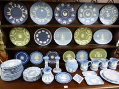 A COLLECTION OF WEDGWOOD JASPERWARES INCLUDING CHRISTMAS PLATES, MUGS, A BISCUIT BARREL,