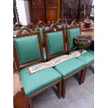 SET OF SIX VICTORIAN CARVED OAK GOTHIC REVIVAL DINING CHAIRS.