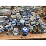 A LARGE COLLECTION OF BLUE AND WHITE WARES TO INCLUDE IRON STONE, SPODE, GIBSON AND SONS, POWELL -