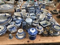 A LARGE COLLECTION OF BLUE AND WHITE WARES TO INCLUDE IRON STONE, SPODE, GIBSON AND SONS, POWELL -