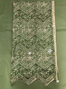 A ISLAMIC SILK BANNER WITH CALLIGRAPHIC SCRIPT