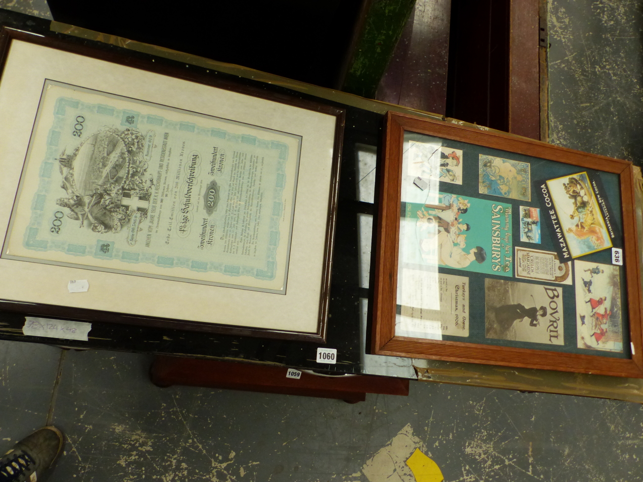 A 1908 AUSTRIAN STOCK OR SHARE CERTIFICATE TOGETHER WITH A FRAME OF ADVERTISING FLIERS