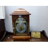 A LARGE OAK CASE MANTEL CLOCK TOGETHER WITH A SWISS EASEL BACK VINTAGE CLOCK