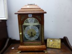 A LARGE OAK CASE MANTEL CLOCK TOGETHER WITH A SWISS EASEL BACK VINTAGE CLOCK