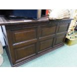 AN ANTIQUE AND LATER OAK PANEL FORMED COFFER H 61 x W 121 x D 54 cm's