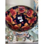 A MOORCROFT SHALLOW BOWL IN A POMEGRANATE DESIGN