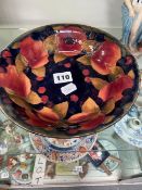 A MOORCROFT SHALLOW BOWL IN A POMEGRANATE DESIGN