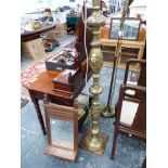 AN EDWARDIAN WALNUT SHELF MIRROR TOGETHER WITH A EASTERN BRASS FLOOR LAMP