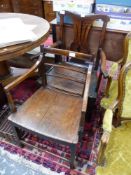 AN 18th C. OAK CHIPPENDALE TASTE ELBOW CHAIR TOGETHER WITH A LATE 18th C. MAHOGANY ELBOW CHAIR