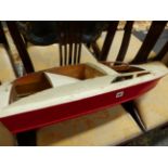 A VINTAGE MODEL SPEEDBOAT.