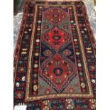 AN ANTIQUE CAUCASIAN KAZAK RUG 220 x 132 cm's