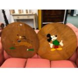 TWO WOODEN TABLE TOP COVERS PAINTED WITH MICKEY MOUSE AND PLUTO DISNEY FIGURES.