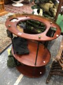 AN UNUSUAL VINTAGE OVAL MAHOGANY CAMPAIGN WASHSTAND, METAL SUPPORTS WITH BRASS MOUNTS