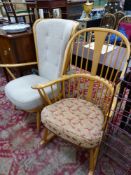 AN ERCOL STICK BACKED ROCKING CHAIR TOGETHER WITH AN ERCOL ARMCHAIR