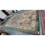 A VINTAGE MACHINE MADE CARPET OF ARTS AND CRAFTS DESIGN 544 x 353 cms