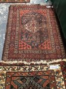 AN ANTIQUE PERSIAN TRIBAL RUG 270 x 112 cm's TOGETHER WITH A SMALL PERSIAN SHIRAZ RUG 143 x 115 cm'