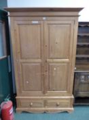 MODERN PINE TWO DOOR WARDROBE WITH BASE DRAWERS. H 200 x W 126 x D 60cms