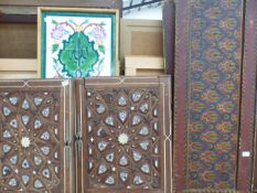 VARIOUS EASTERN INLAID AND POLY CHROMED DECORATED PANELS TOGETHER WITH A TILE PICTURE