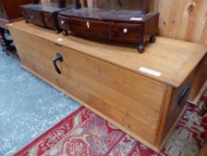 A PINE COFFER WITH PULL DOWN DOOR TO THE FRONT. W 140 x D 48 x H 40cms.