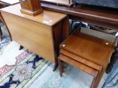 A 1970S TEAK DROP FLAP DINING TABLE. W 132 x D 91 x H 73cms. TOGETHER WITH A NEST OF THREE TEAK