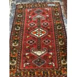 A PERSIAN TRIBAL RUG OF AFSHAR TYPE 162 x 108 cm