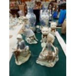 THREE LLADRO FIGURES, A PAIR OF CAT FIGURES AND A PAIR OF TABLE LAMPS.