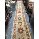 A ORIENTAL RUNNER OF ZIEGLER DESIGN 624 x 74 cms