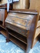 A VINTAGE OAK SLANT TOP WRITING DESK H 108 x W77 x D 27cms