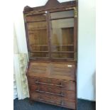 AN INTERESTING AESTHETIC/ ARTS AND CRAFTS 19TH CENTURY CARVED OAK SECRETARY BOOK CASE GLAZED UPPER