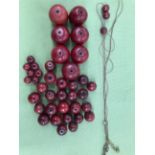 LOOSE GRADUATED CHERRY RED BEADS.