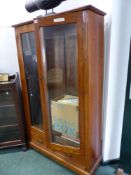 A LATE VICTORIAN OAK GLAZED TWO DOOR BOOKCASE WITH BASE DRAWERS. H 172 W 106 D 34 cm's