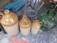 THREE STONEWARE TWO TONE FLAGONS, A GLASS MIXING BOWL AND STIRRER TOGETHER WITH A DEMIJOHN