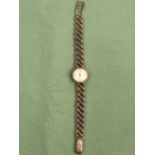 A LADIES 9ct GOLD TUDOR BRACELET WATCH THE LADDER CLASP STAMPED ROLEX WITH A ROLEX LOGO, GROSS