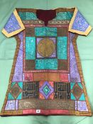 A ISLAMIC TUNIC WITH POLYCHROME AND GILT DECORATION