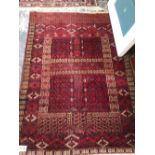 AN ANTIQUE HATCHLI BOKHARA RUG 165 x 121 cm's