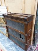 A GLOBE WERNICKE LEADED GLAZED OAK THREE TIER BOOK CASE