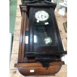 A ANTIQUE MAHOGANY CASED DROP DIAL VIENNA TYPE WALL CLOCK TOGETHER WITH A LATER OAK EXAMPLE AND A
