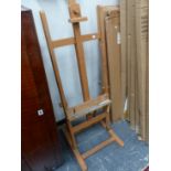 AN ARTISTS EASEL AND A FOLDING TOWEL RAIL