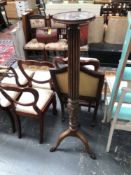 A ANTIQUE CARVED MAHOGANY TORCHERE STAND